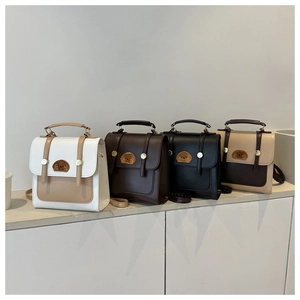 Detailed view of vintage PU leather backpacks with cute bear patches in four colors