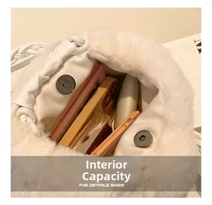 Top view of white plush bucket bag showing interior capacity with phone and palettes
