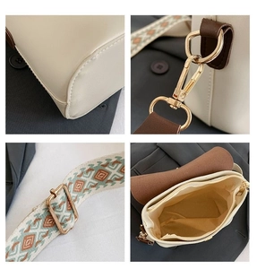 Détails du sac bandoulière avec sangle ethnique large et accents en métal doré