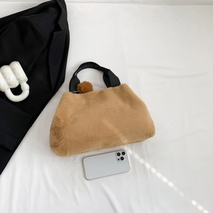 Plush khaki faux fur handbag with black strap and fuzzy pom pom for autumn and winter