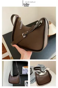 Detail of coffee crescent shoulder bag featuring lychee texture and silver hardware buckle