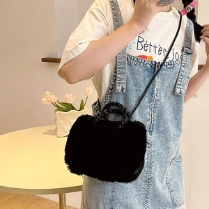Elegant black plush crossbody bag with woven handle and leather strap for women
