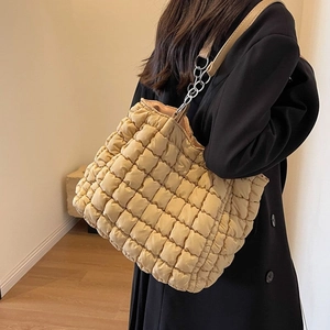 Beige quilted puffer tote bag with silver chain strap for casual daily commuting
