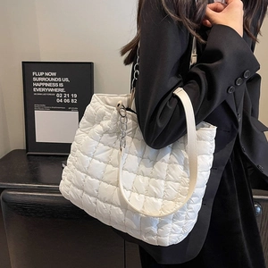White quilted cloud tote bag with dual straps and chain detail for women's casual fashion