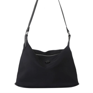 Minimalist black waterproof nylon shoulder bag with a sleek finish and silver metal rings