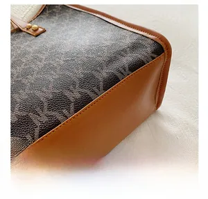 Detailed macro view of the horse logo canvas pattern and fine leather stitching on tote bag