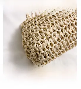 Detailed macro shot of the premium woven texture on this natural beige handmade handbag