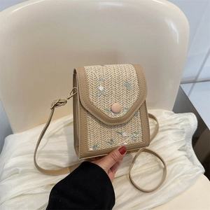 Small woven crossbody phone bag with floral embroidery and brown faux leather strap