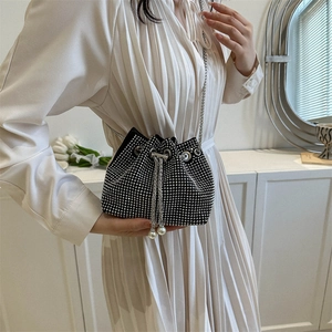 Elegant black bucket bag with silver rhinestones, drawstring closure and pearl detail