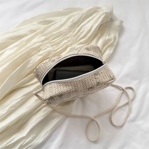 Chic cream-colored woven straw heart-shaped crossbody bag with zipper closure and strap