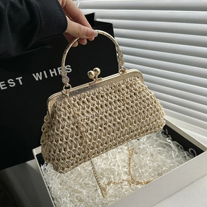Handmade woven evening bag with golden metal handle and pearl clasp in a gift box