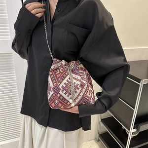 Ethnic geometric woven bucket bag with pearl drawstring and silver chain strap