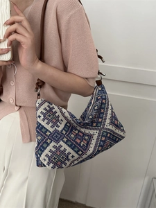 Ethnic knit hobo shoulder bag with colorful geometric patterns and brown leather strap