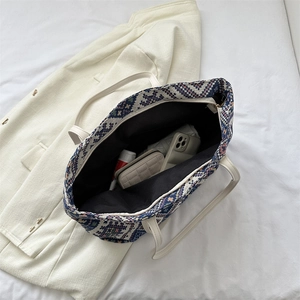 Top view of woven tote bag showing spacious interior compartment and geometric pattern