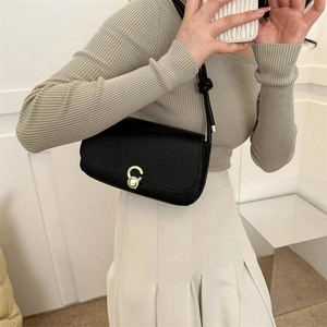 Retro black leather underarm bag with gold ring buckle and shoulder strap for women