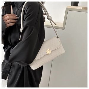 White quilted baguette shoulder bag with gold arch lock and crocodile texture trim