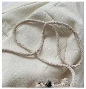 Close-up of soft woven cotton shoulder strap with Romantic Time minimalist design