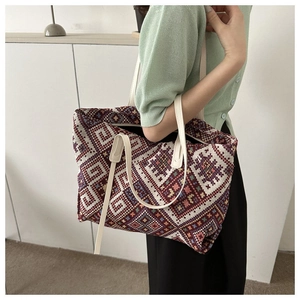 Detailed macro of the colorful geometric woven canvas fabric and sturdy tote straps
