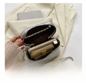 Quilted silver chain bag interior showing space for phone, wallet and lipstick