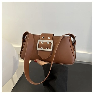 Detail view of brown baguette bag with smooth PU leather and silver square buckle