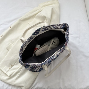 Ethnic geometric canvas tote bag with leather handles and spacious interior layout