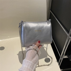 Silver metallic pillow shoulder bag with chain strap and Only Bug logo on front
