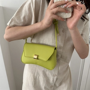 Lime green minimalist baguette bag with golden buckle and knotted shoulder strap