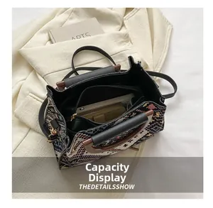 Detail view of ethnic tote bag showing large capacity interior with zipper pocket