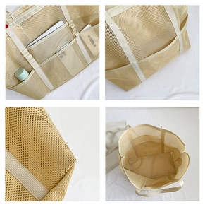 Detail view of large mesh beach bag with multi-pocket design and reinforced handles