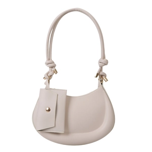 Chic beige half-moon shoulder bag with knot strap detail and attached mini pouch