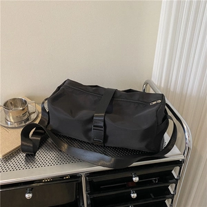 Black waterproof nylon gym tote bag with cylinder structure and adjustable shoulder strap