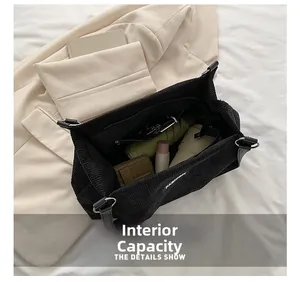 Internal capacity of large black corduroy tote bag showing spacious storage space