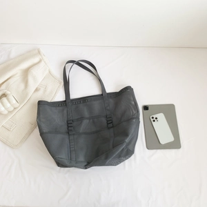 Large gray mesh beach tote bag with side pockets and carry handles on white background