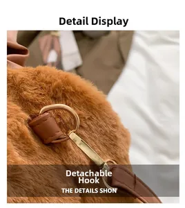 Detail view of the brown plush bag featuring gold metal hooks and leather attachment straps