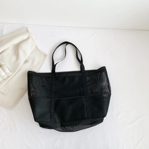 Large black mesh beach tote bag with durable webbed handles for versatile storage