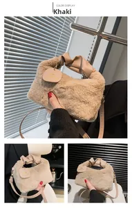 Detailed close-up of khaki plush faux fur handbag with a pleated faux leather top handle
