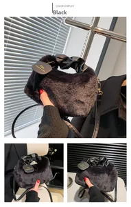 Detail showing plush black faux fur texture and elegant ruched leather handle on handbag