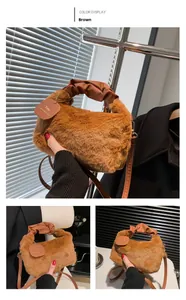 Detail of plush brown faux fur handbag with ruched leather handle and brand tag