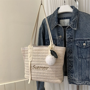 Woven straw tote bag with Summer embroidery and cream leather handles for women
