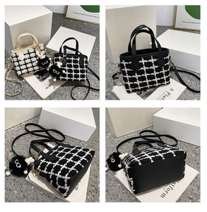 Detail of tweed bucket bag showing checkered fabric texture and plush charm