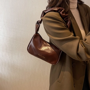 Chocolate brown baguette shoulder bag with pleated handle and fashion text design