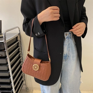 Brown quilted faux leather shoulder bag with gold wheel lock and retro chic style