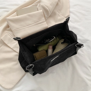 Black corduroy tote bag with large capacity interior for commuting and fashion use