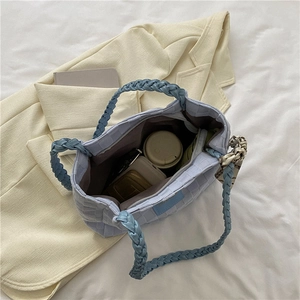 Light blue quilted tote bag with silk scarf showing spacious interior with essentials
