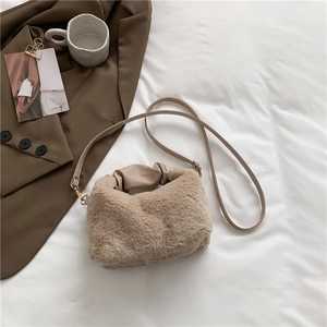 Chic apricot plush faux fur handbag with leather straps for women in a lifestyle setting