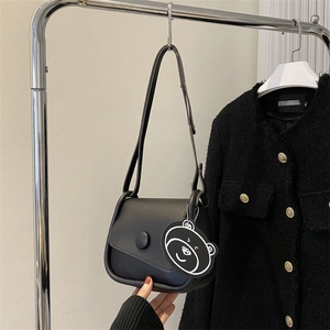 Minimalist black PU leather crossbody bag with round buckle and cute bear pendant charm