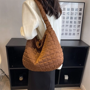Brown quilted large hobo shoulder bag with a padded texture and diamond stitching