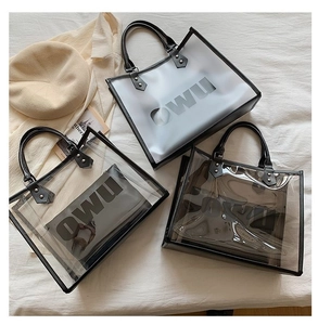 Detailed overhead view of three PVC tote bags in transparent, frosted, and smoke grey finishes