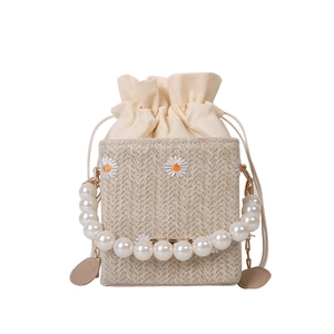 Straw woven crossbody bag with daisy embroidery and elegant pearl handle strap