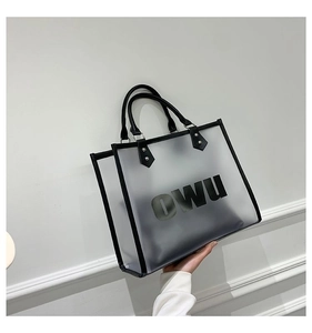 Detail of translucent frosted tote bag with black trim and OWU letter printing